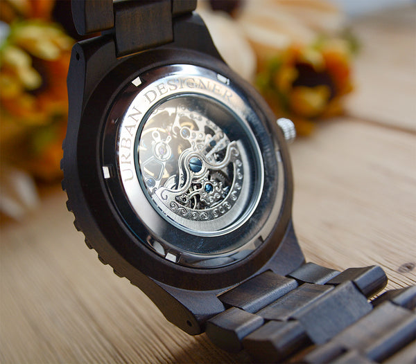 A classy watch made of wood featuring transparent body with gear face by Urban Designer.