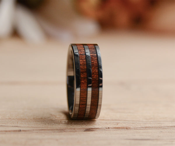 A mens wooden ring with tungsten inlay from Urban Designer.