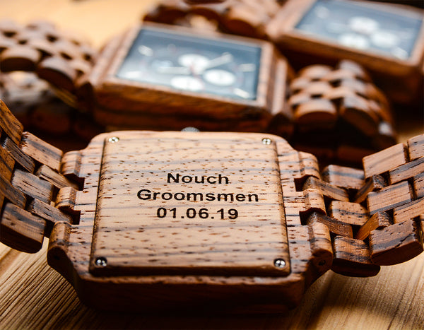 An engraved groomsmen wooden watch made with zebra wood from Urban Designer.